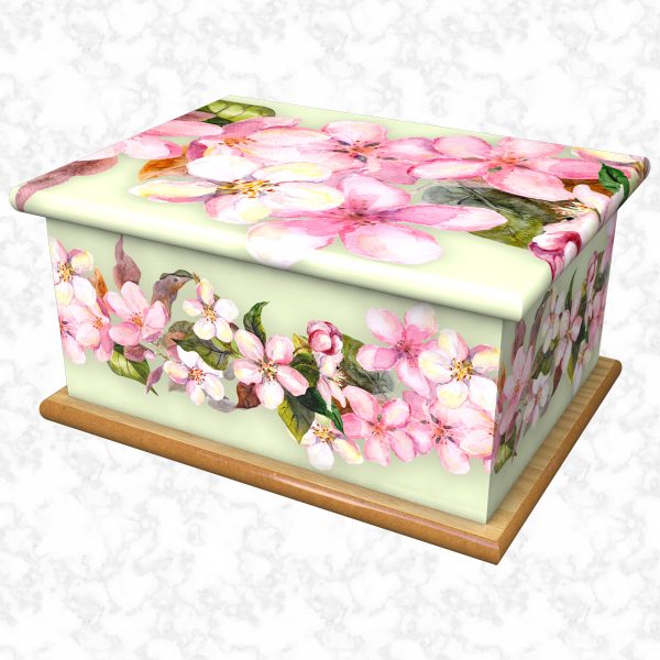 Pastel pinks ashes casket with green background