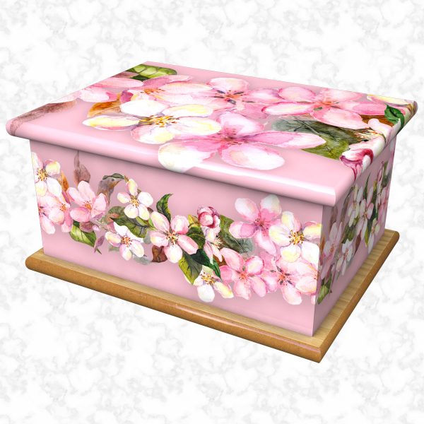 Pastel pinks ashes casket with pink background