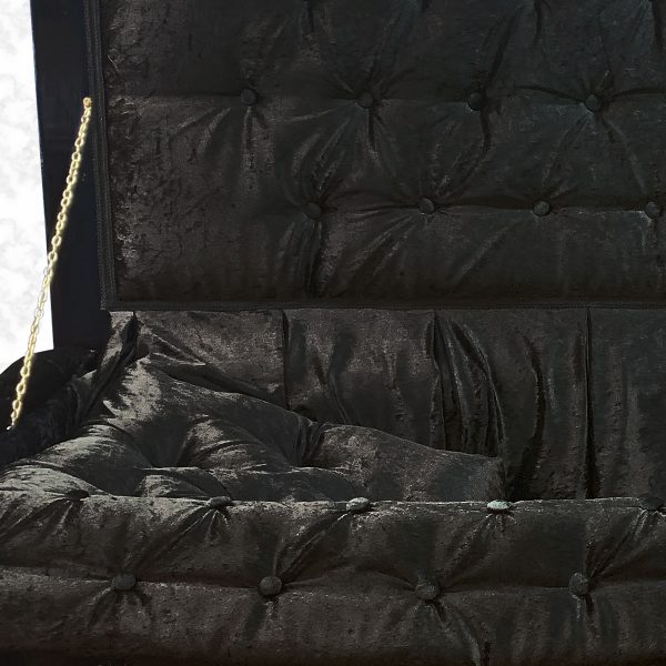 Royal black American casket interior in detail